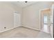 Bedroom with neutral walls, carpeted floor, a double door closet, and access to an adjacent room at 9008 Brookfield Ter, Bradenton, FL 34212