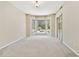 Open bedroom boasts large windows with a view of the pool and patio area at 9008 Brookfield Ter, Bradenton, FL 34212
