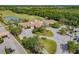 Aerial shot of the community clubhouse featuring meticulous landscaping and convenient parking at 9008 Brookfield Ter, Bradenton, FL 34212