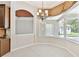 Bright dining area featuring large bay windows with views of the pool and backyard at 9008 Brookfield Ter, Bradenton, FL 34212