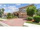 Picturesque two-story home with a three-car garage, brick paver driveway, and lush lawn at 9008 Brookfield Ter, Bradenton, FL 34212