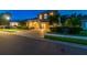 Elegant two-story home offers a brick driveway, three car garage, and manicured front lawn at 9008 Brookfield Ter, Bradenton, FL 34212