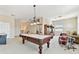 Bright game room features a pool table, drums, neutral paint, and ample space for recreation at 9008 Brookfield Ter, Bradenton, FL 34212