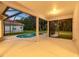 Covered patio with a swimming pool, an extended screen, and outdoor views at 9008 Brookfield Ter, Bradenton, FL 34212