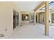 Open patio with sliding glass doors and views of the home's interior, perfect for outdoor entertaining at 9008 Brookfield Ter, Bradenton, FL 34212