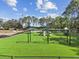 Bright and fun community playground with swings, slides, and climbing structures on artificial grass at 9008 Brookfield Ter, Bradenton, FL 34212