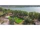 Aerial view of a playground on astroturf near a lake offering scenic views for recreational activities at 9008 Brookfield Ter, Bradenton, FL 34212