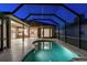 Beautiful covered pool with a spacious patio area, perfect for outdoor entertaining during the evening at 9008 Brookfield Ter, Bradenton, FL 34212