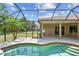 Screened-in pool and patio area with beautiful landscaping and an expansive view of backyard at 9008 Brookfield Ter, Bradenton, FL 34212