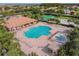 Aerial view of community pool and splash pad with ample seating, creating an inviting aquatic area at 9008 Brookfield Ter, Bradenton, FL 34212