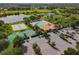 Aerial view of recreational amenities: shuffleboard, pool, and beach volleyball at 9008 Brookfield Ter, Bradenton, FL 34212