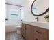 Bathroom featuring modern vanity and fixtures with tub/shower combo and patterned tile at 9017 Province St, Sarasota, FL 34240