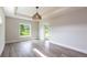 Bright bedroom with decorative ceiling and large window overlooking outdoors at 9017 Province St, Sarasota, FL 34240