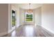 Bay window dining area with stylish light fixture and tile floors at 9017 Province St, Sarasota, FL 34240