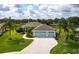 Inviting home with well-manicured lawn, lush landscaping, and a spacious three-car garage at 9017 Province St, Sarasota, FL 34240