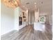 Open concept kitchen with stainless appliances, island, and eat-in dining area at 9017 Province St, Sarasota, FL 34240