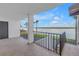 Balcony showcasing waterfront views, a black metal railing, and an outdoor area perfect for relaxing at 9393 Midnight Pass Rd # 603, Sarasota, FL 34242