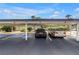 Carport with parking spaces available for residents and guests at 9393 Midnight Pass Rd # 603, Sarasota, FL 34242