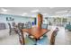 Inviting community space with dining tables, comfortable chairs, and relaxing views with plenty of natural light at 9393 Midnight Pass Rd # 603, Sarasota, FL 34242