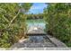 Easy access to water via dock and steps, with swim ladder, surrounded by mangroves and calm waters at 9393 Midnight Pass Rd # 603, Sarasota, FL 34242