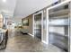 Modern building elevators accessing residence, near seating and decorations at 9393 Midnight Pass Rd # 603, Sarasota, FL 34242