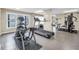 Community gym featuring exercise equipment, treadmills, and large windows with an ocean view at 9393 Midnight Pass Rd # 603, Sarasota, FL 34242
