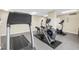 Modern gym featuring treadmills, ellipticals, and stationary bikes for cardio workouts at 9393 Midnight Pass Rd # 603, Sarasota, FL 34242