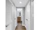 Hallway features three doors and dark wood-look floors at 9393 Midnight Pass Rd # 603, Sarasota, FL 34242