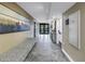 Hallway with artwork and seating areas creating an inviting and aesthetically pleasing atmosphere at 9393 Midnight Pass Rd # 603, Sarasota, FL 34242