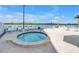 Beautiful hot tub with an ocean view surrounded by lounge chairs to relax and enjoy the sea breeze at 9393 Midnight Pass Rd # 603, Sarasota, FL 34242