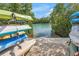 Kayak launch area showcasing stacked kayaks against a backdrop of lush greenery and tranquil waterway access at 9393 Midnight Pass Rd # 603, Sarasota, FL 34242