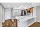 Kitchen area featuring stainless appliances, hardwood floors, and quartz counters at 9393 Midnight Pass Rd # 603, Sarasota, FL 34242