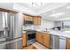 Kitchen featuring stainless steel appliances and modern fixtures with an open floor plan at 9393 Midnight Pass Rd # 603, Sarasota, FL 34242