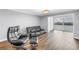 Cozy living area with sleek black furniture and a large window offering scenic views at 9393 Midnight Pass Rd # 603, Sarasota, FL 34242