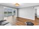 Bright living room with a large window, wood floors, and relaxing water view at 9393 Midnight Pass Rd # 603, Sarasota, FL 34242