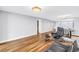 Spacious living area with a view of other rooms, wood floors, and modern lighting at 9393 Midnight Pass Rd # 603, Sarasota, FL 34242