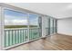 Sun-filled living area with sliding glass doors and a view of water at 9393 Midnight Pass Rd # 603, Sarasota, FL 34242