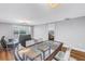 Bright living room featuring a glass table, water view and modern gray paint at 9393 Midnight Pass Rd # 603, Sarasota, FL 34242