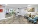 Lobby area with stylish seating, decor, and large mirror, providing a comfortable space at 9393 Midnight Pass Rd # 603, Sarasota, FL 34242
