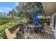 Outdoor patio space with comfortable seating, BBQ grill and views of the water, perfect for entertaining and relaxation at 9393 Midnight Pass Rd # 603, Sarasota, FL 34242