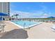 Resort-style pool with lounge chairs and ocean views for relaxing and enjoying the Florida sunshine at 9393 Midnight Pass Rd # 603, Sarasota, FL 34242