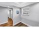 Room with hardwood floors and a window view at 9393 Midnight Pass Rd # 603, Sarasota, FL 34242