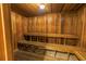 Private sauna room with wooden walls, benches, and overhead light offers a relaxing retreat at 9393 Midnight Pass Rd # 603, Sarasota, FL 34242