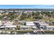 Aerial view of waterfront homes with docks and boats with trees throughout at 9822 Desoto Ct, Bradenton, FL 34210