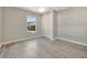 Bedroom features gray walls, light gray floors, a double door closet, and a bright window at 9822 Desoto Ct # 0, Bradenton, FL 34210