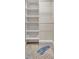 Walk-in closet featuring built-in shelving and a clothing rod, providing ample storage space at 9822 Desoto Ct, Bradenton, FL 34210