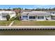 Charming waterfront home with blue shutters, a cozy front porch, and well-maintained landscaping at 9822 Desoto Ct, Bradenton, FL 34210