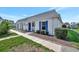 Charming single-story home with white exterior, blue shutters, and well-maintained landscaping at 9822 Desoto Ct # 0, Bradenton, FL 34210