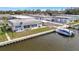 Waterfront home featuring a private boat dock, and lush green lawn for enjoying waterfront living at 9822 Desoto Ct, Bradenton, FL 34210