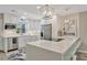 Contemporary kitchen with white cabinetry, quartz countertops, stainless steel appliances, and stylish lighting at 9822 Desoto Ct, Bradenton, FL 34210